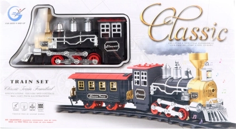 Klasická vláčkodráha s kouřící lokomotivou