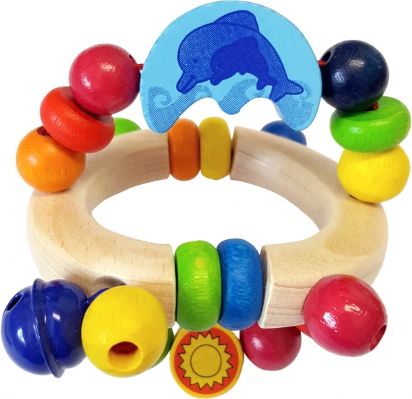 Dřevěné chrastítko s delfínem